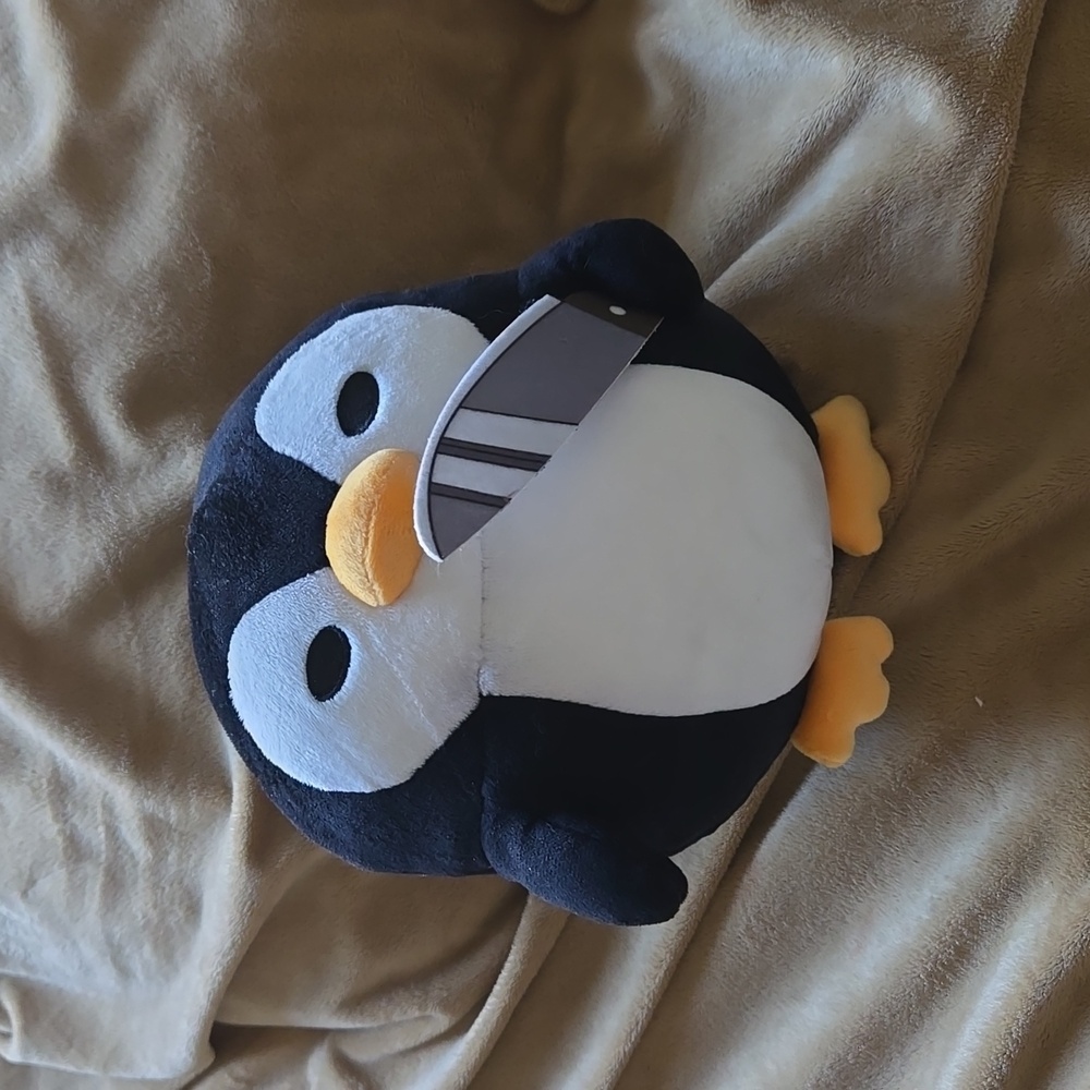 Hot Topic penguin with knife stuffed animal